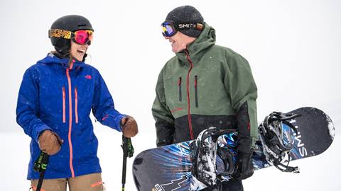 Skier and Snowboarder talking