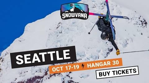 Skier flies through the air doing a trick with promotional text for Snowvana written across the screen. 