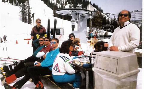 An Old Photo of a Group of People Gathered Around the Rex 