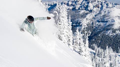 Snowboarder Riding Deep Snow