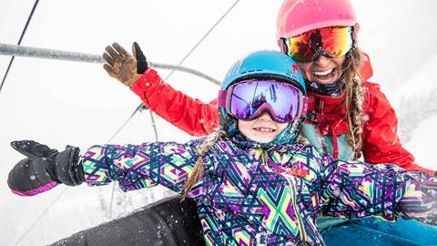 Child and Mom Riding Chairlift